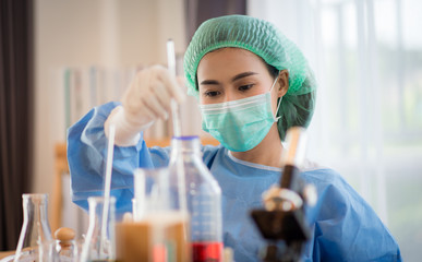 Asian Young scientist works in modern biological lab