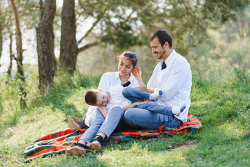 Happy family dad mom and son having fun and playing