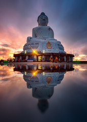 Big Buddha statue Landmark of Phuket Thailand on sunrise and refection.