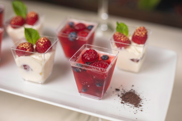 Buffet menu of the catering company on a wooden table in a restaurant
