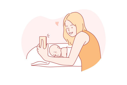 Selfie, motherhood, childhood, family concept. Young woman mother taking selfie with newborn baby sleeping in bed or video calling to father or relatives. New generation parenthood and mothers day.