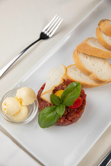 
Snacks on a white plate in a restaurant