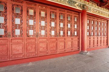 red wooden door or gate,ancient Chinese architecture: garden