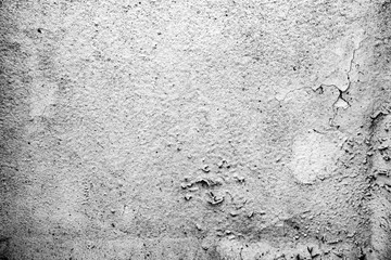 Texture of a concrete wall with cracks and scratches which can be used as a background