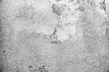 Texture of a concrete wall with cracks and scratches which can be used as a background