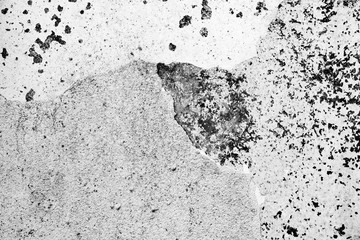 Texture of a concrete wall with cracks and scratches which can be used as a background