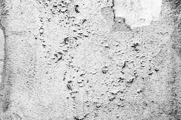 Texture of a concrete wall with cracks and scratches which can be used as a background