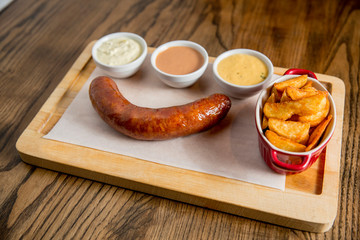 Sausage and potatoes with sauces