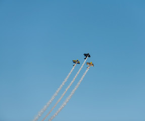 Airplanes on airshow. Aerobatic team performs flight at air show