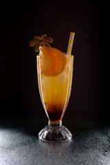 Refreshing cool mango rum collins on the bar counter. Cocktail at a party