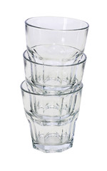 Three bar glasses for whiskey inserted into each other. A pyramid of clean glasses. Isolated on a white background.