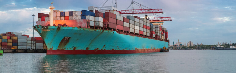 Container cargo ship load in the seaport. Logistics and transportation of Container Cargo ship with...