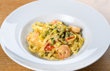 Italian tagliatelle with asparagus and shrimps or scampi, dill cream sauce.Fresh Food Dining Eating