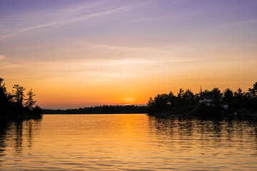 Obraz na płótnie Canvas Purple and Orange Sunset on the Lake