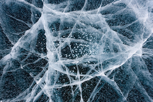 Beautiful ice of Lake Baikal with abstract cracks