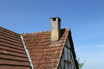 Tile roof with chimney of an old house