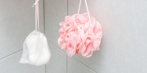 Soap and soft pink bath puff