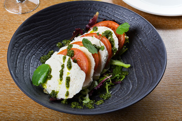 Caprese salad is a simple Italian salad, made of sliced fresh mozzarella, tomatoes,Insalata Caprese