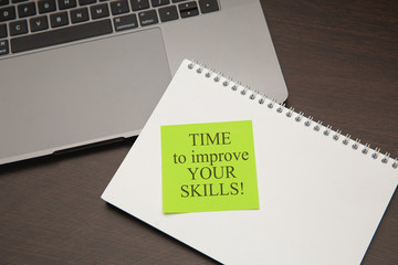 Improve your skills, message on green sticky note.The best advice on how to improve your life.