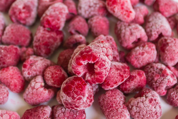 Delicious frozen raspberries. Concept of healthy eating, vegetarianism. Selective focus.