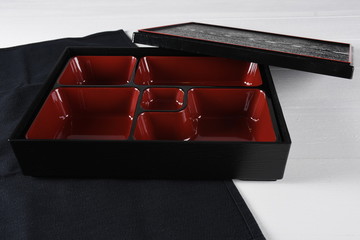 Red and black empty bento box, traditional japanese tray sushi, nigiri, sashimi specialties