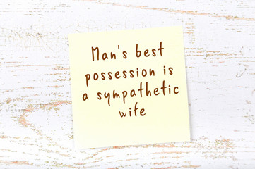 Yellow sticky note with handwritten motivational quote