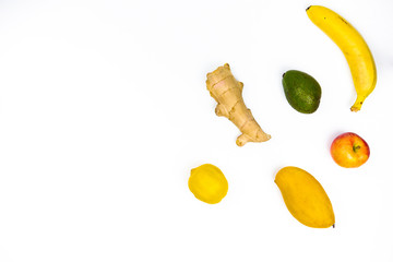 Fototapeta na wymiar ginger, avocado, banana, yellow mango, lemon on a white background top view with space for text