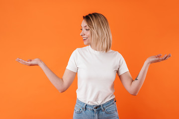 Image of joyful caucasian woman smiling and holding copyspace