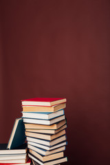 many stacks of educational books to prepare for exams in the university library