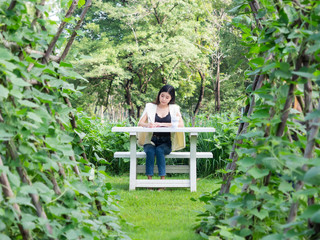 Naklejka na ściany i meble asia business woman farmer smily in garden