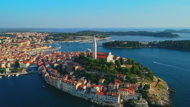 Aerial view from Rovinj historic old beautiful town and Rovinj port and boats under beautiful blue sky aerial view, Croatia	
