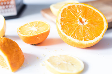 Fototapeta na wymiar Orange and lemon on a white background. Close up