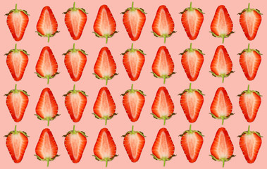 Pattern of strawberry halves on pale pink background