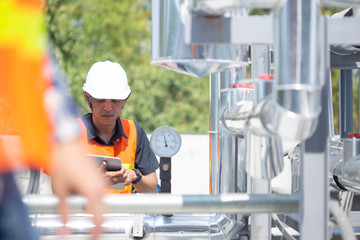 Engineers are checking the air cooled chiller, located on the roofs of the building.