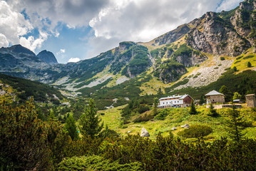Naklejka na ściany i meble Beautiful summer mountain landscape in Rila mountain, Bulgaria. Mountain scenery and a mountain lodge.