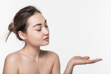 Body skincare care beauty asian woman showing product on side with open hand presenting and displaying isolated on white background.