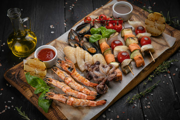 Set of seafood on black wooden backgrounds