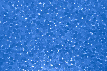 Blue backlight surface with low backlight, closeup. Abstract background, texture.