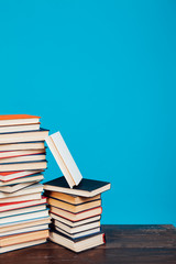 many stacks of educational books to prepare for exams in the university library