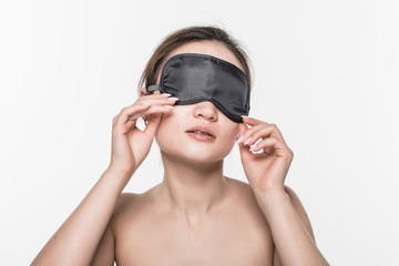 Fototapeta premium Young asian girl with sleeping mask isolated on white background