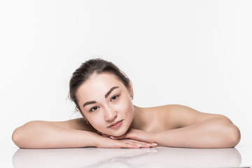 Fototapeta premium Beautiful face skincare beauty asian woman lying down with mirror reflection isolated on white background.