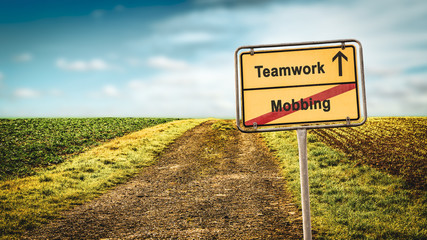 Street Sign to Teamwork versus Mobbing