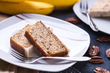 Piece of banana cake on white plate