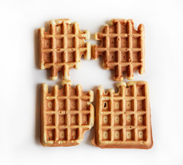 Belgian waffles on wooden plate on a white tablecloth Eating at home