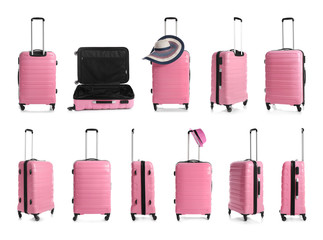 Set of pink suitcases on white background