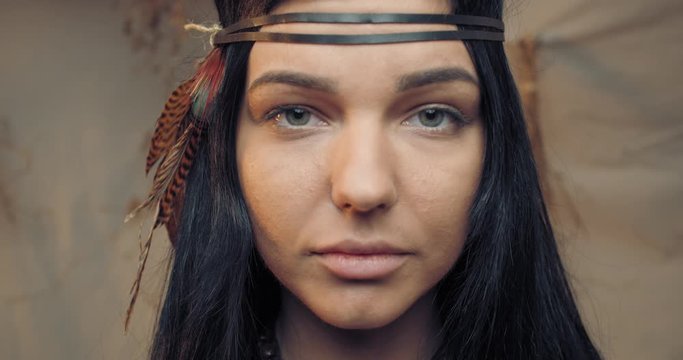 Young native american woman with feathers in her hair, looking, portrait, 4k