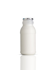 white milk in plastic bottle on white background 