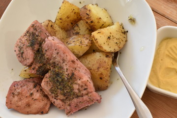 Meat with potatoes and mustard