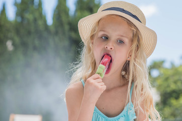 Portrait of a cute girl with ice cream. Summertime fun.