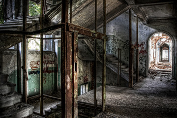 Remains of an elevator and an abandoned staircase in an old building